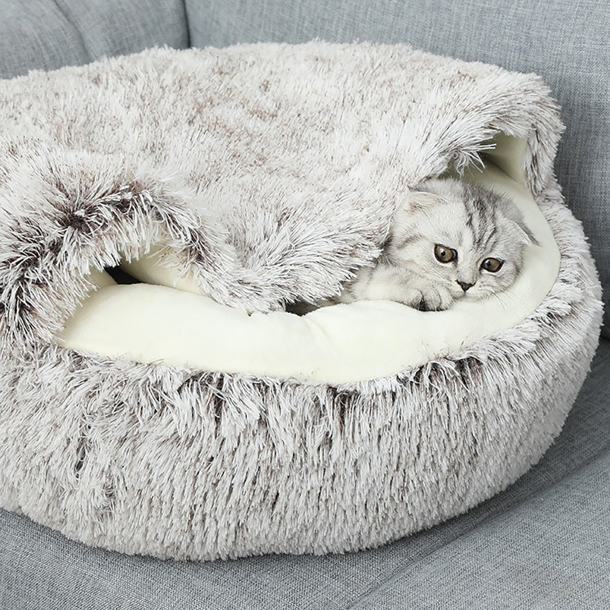 CareHaven plush donut cat bed with cozy cave design, ideal for small cats and dogs, soft and comfortable interior.