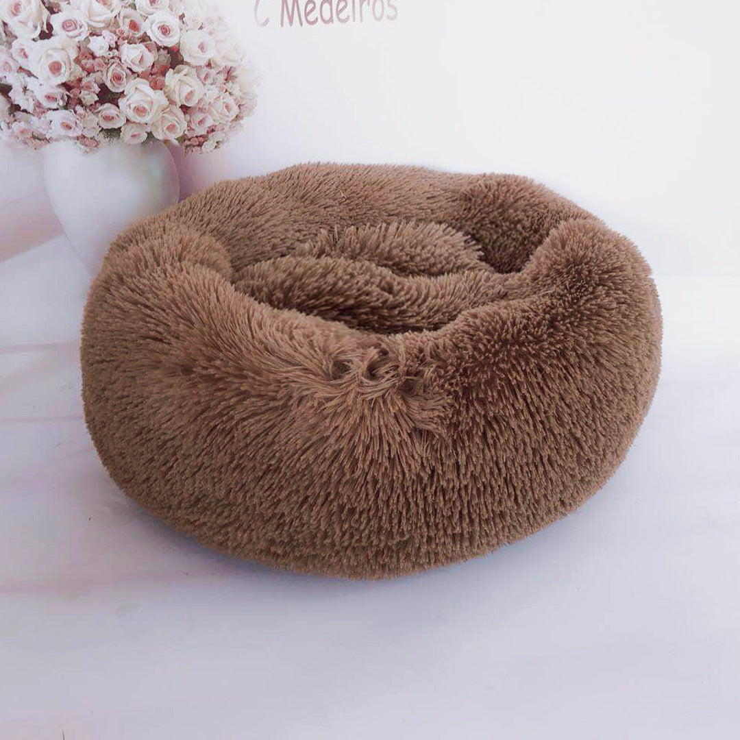Soft plush pet nest bed for dogs and cats by CareHaven, featuring a cozy, cushioned interior and raised edges for comfort.