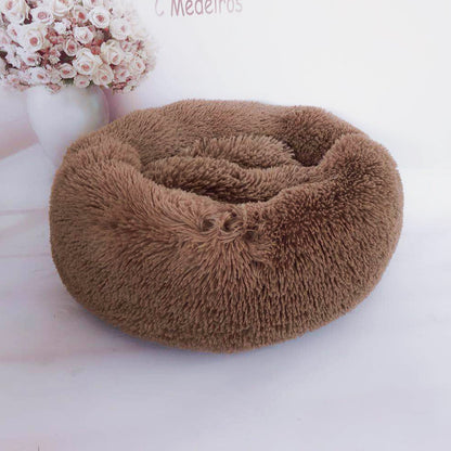 Soft plush pet nest bed for dogs and cats by CareHaven, featuring a cozy, cushioned interior and raised edges for comfort.