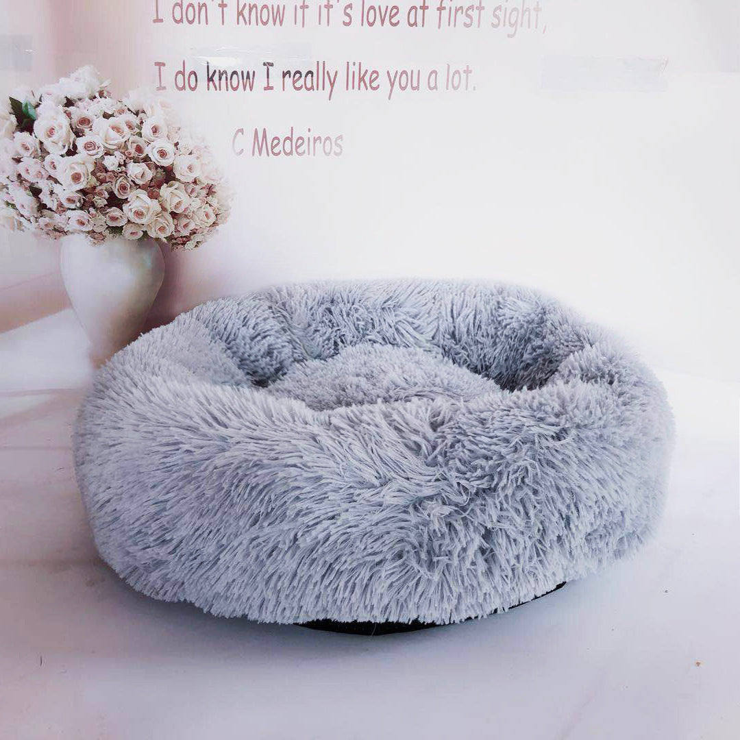Soft plush pet nest bed by CareHaven with cozy, cushioned interior for dogs and cats to rest comfortably.