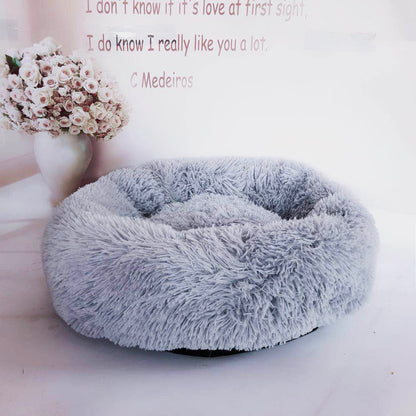 Soft plush pet nest bed by CareHaven with cozy, cushioned interior for dogs and cats to rest comfortably.