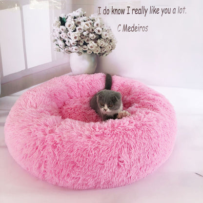 Soft plush pet nest bed for dogs and cats by CareHaven, featuring a cozy, cushioned interior and raised edges for comfort.