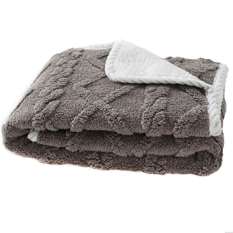 CareHaven plush pet blanket, soft cozy throw for dogs and cats, shown draped over a pet bed with fluffy texture.