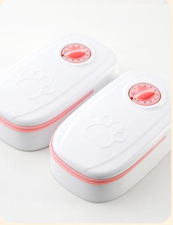 CareHaven automatic pet feeder and water dispenser for dogs and cats, with food and water bowls, in a home setting.