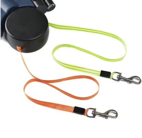 Auto double dog leash from Petcartsupply.store showing a sturdy black leash with two adjustable straps for walking two dogs simultaneously.
