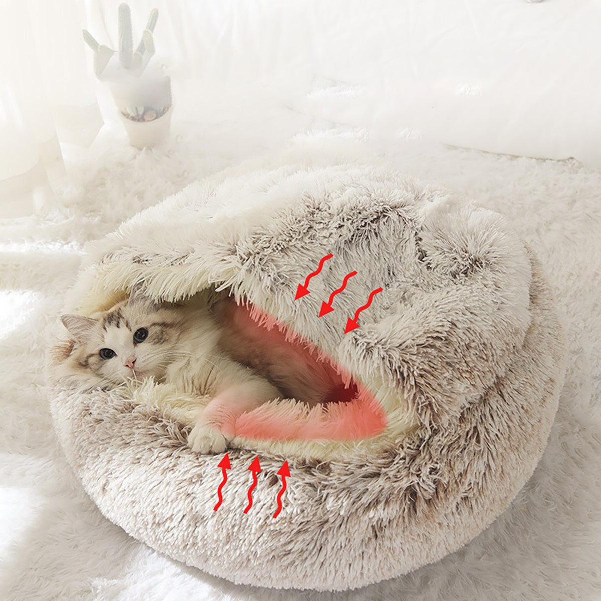 Soft plush donut cat bed by CareHaven featuring a cozy cave design for cats and small dogs, with a circular opening and plush interior.